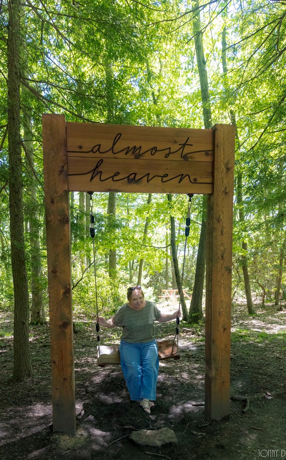Amy on an Almost Heaven swing in the woods at Harpers Ferry.